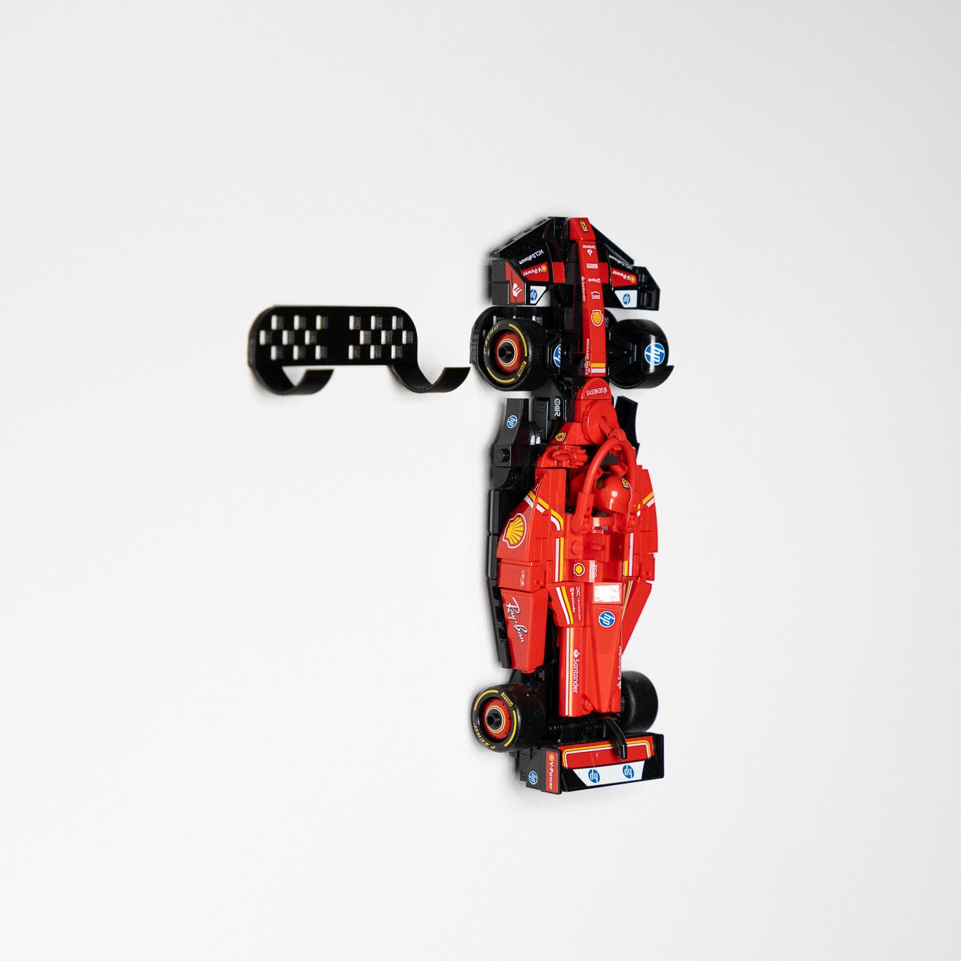 Styled lifestyle shot of LEGO F1 Speed Champions cars on the wall