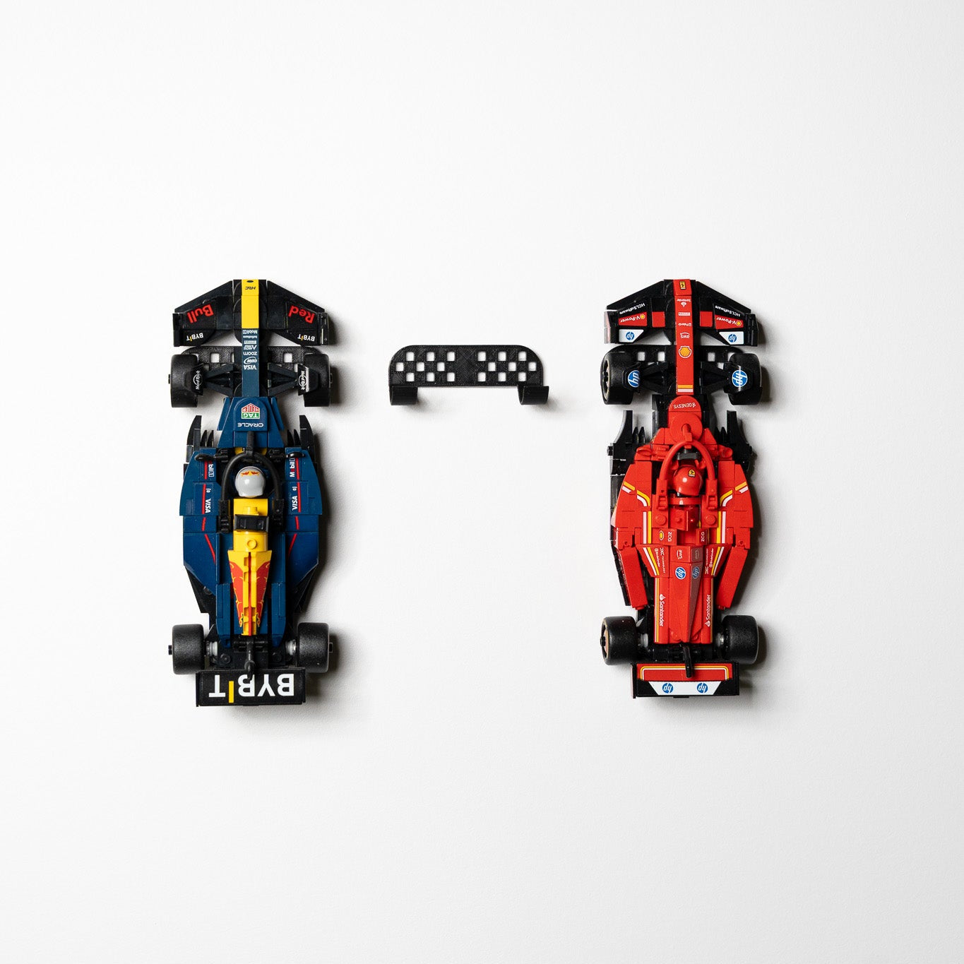 Close-up of the low-profile mount hidden behind a LEGO F1 car's front wheels