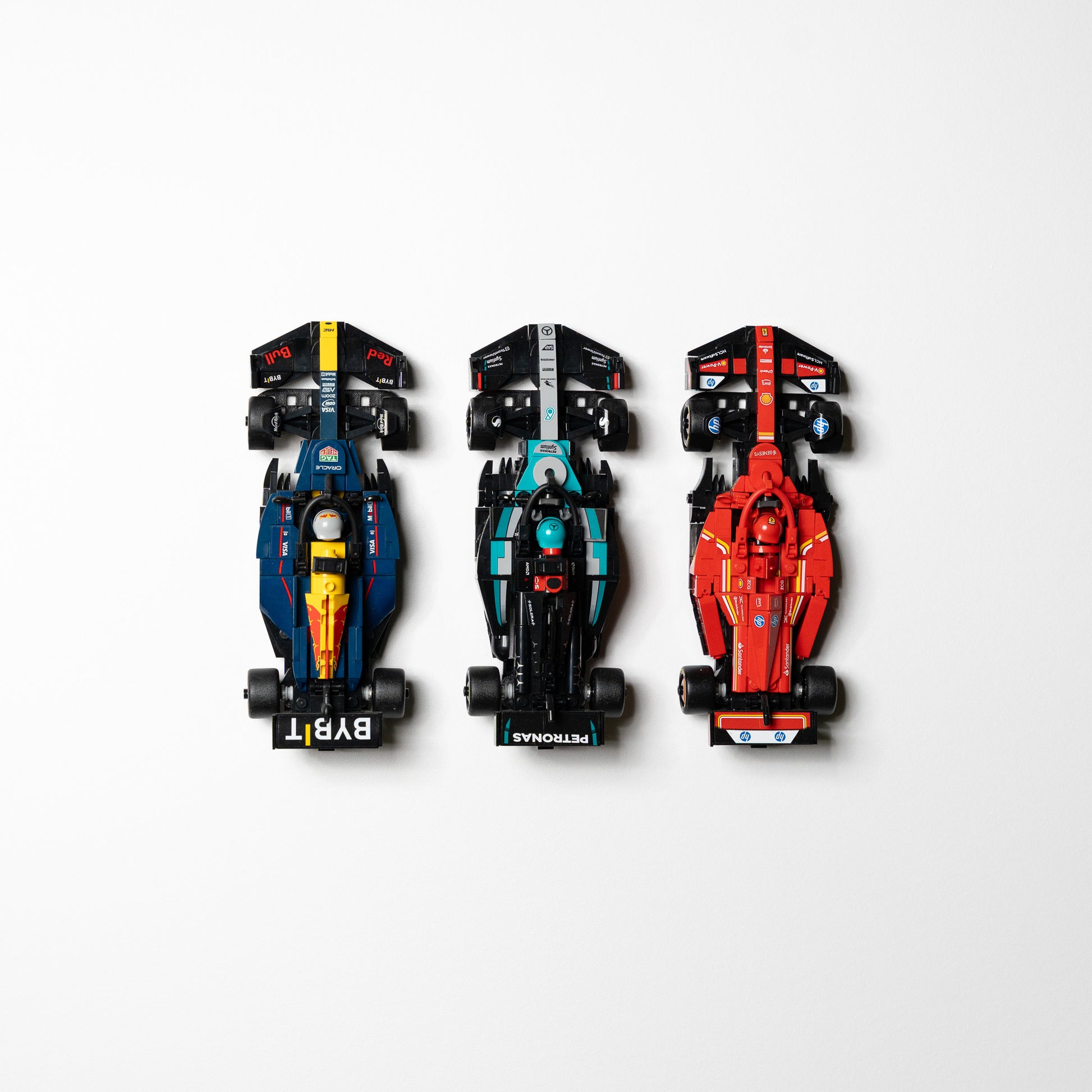 Detail of the 3D-printed wall mount holding a LEGO F1 Speed Champions car