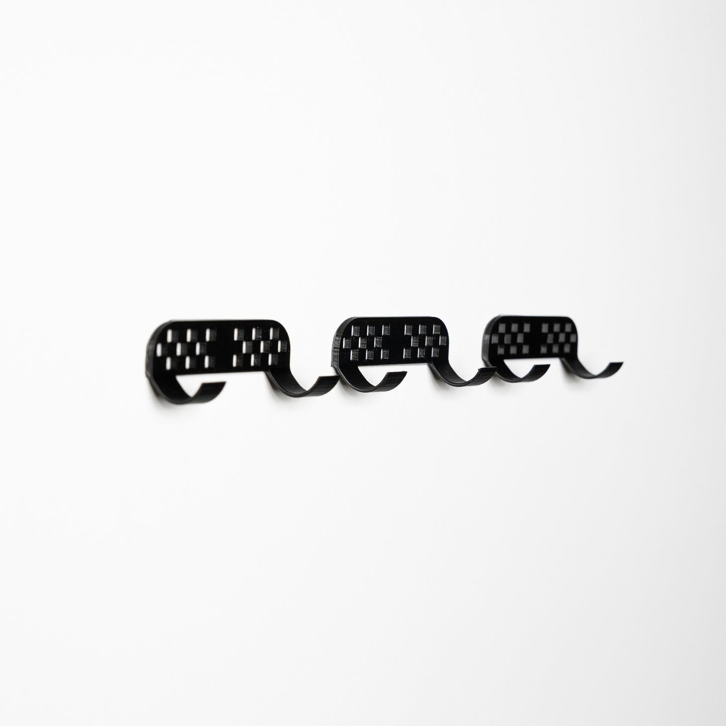 LEGO F1 Speed Champions car shown at an angle on the wall mount