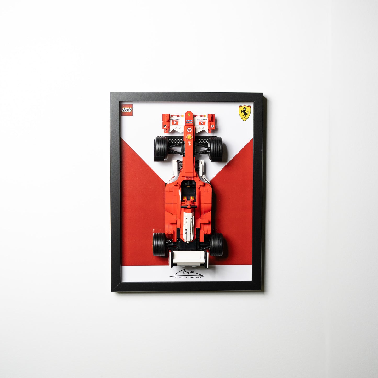 Detail of a LEGO Icons F1 car framed and wall-mounted