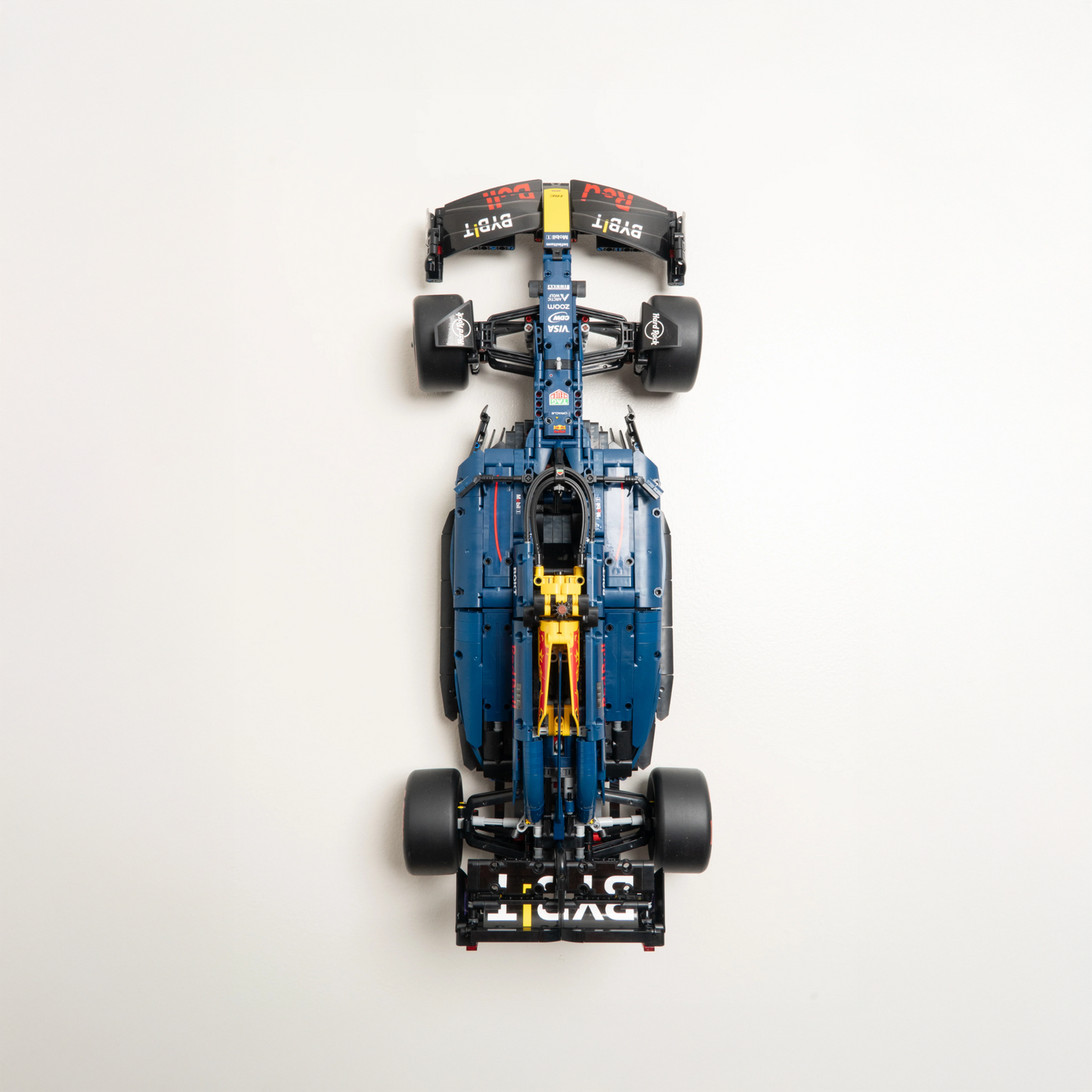 Top-down view of a blue and black toy car model on a white background
