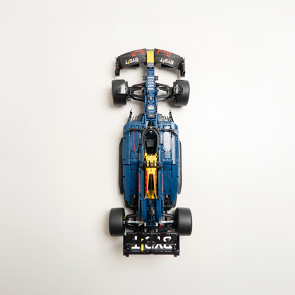 Top-down view of a blue and black toy car model on a white background